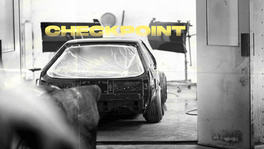 Title card with the word "Checkpoint" black and white image of Dylan's kaido racer Supra in the paint booth.