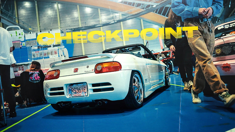 Honda Beat thumbnail at car show with blue floor.