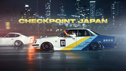 Studio LAB Eagle Mask JDM Toyota sedan kaido racer with Datsun 240Z in the background in the rain being driven at New Year Touring 2025.