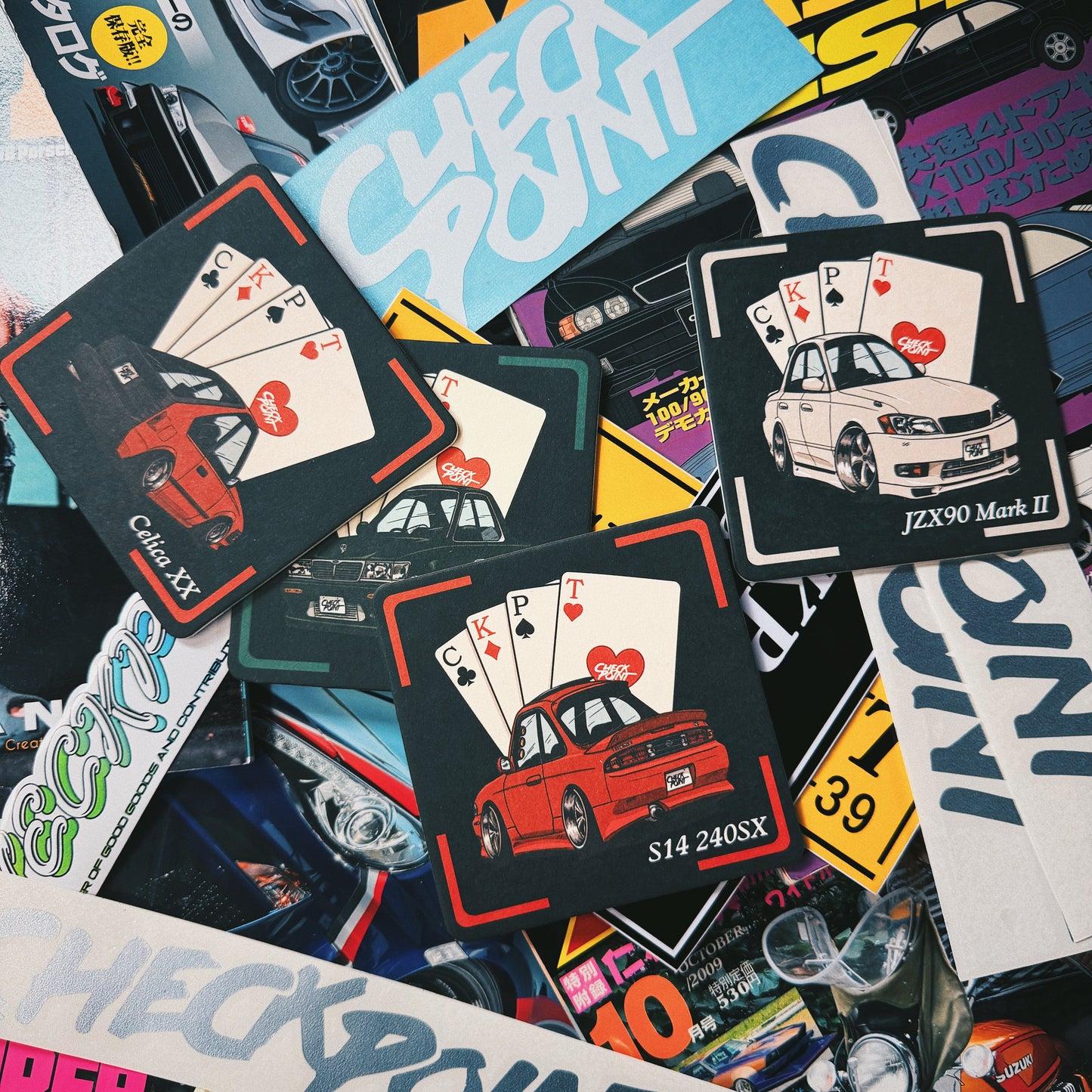 A dense, overlapping collage of stickers and printed decals featuring the word 'CHECK POINT' in various colors and designs, many with illustrations of cars and playing cards.